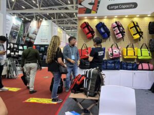 Two visitors discussing products at the exhibition booth
