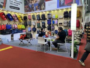 Exhibitors interacting with clients at the booth