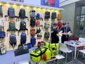 isitors discussing products at the exhibition booth