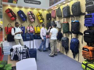 Two visitors discussing products at the exhibition booth
